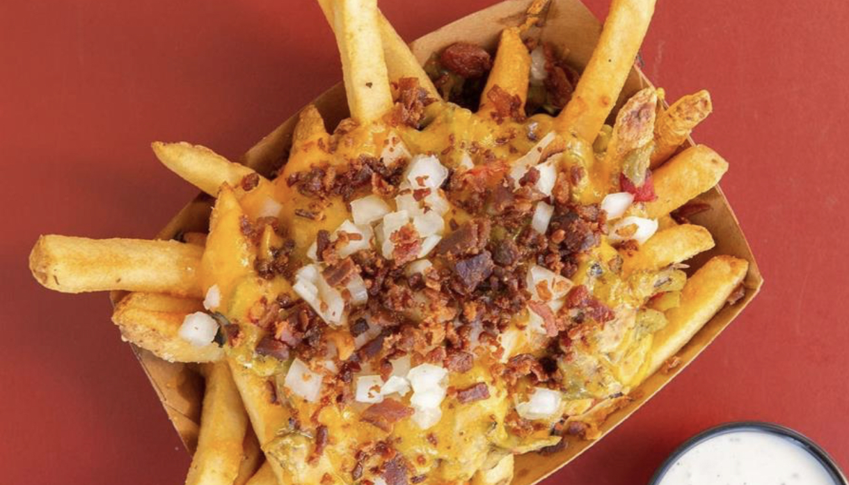 Loaded boardwalk fries with cheese sauce and toppings