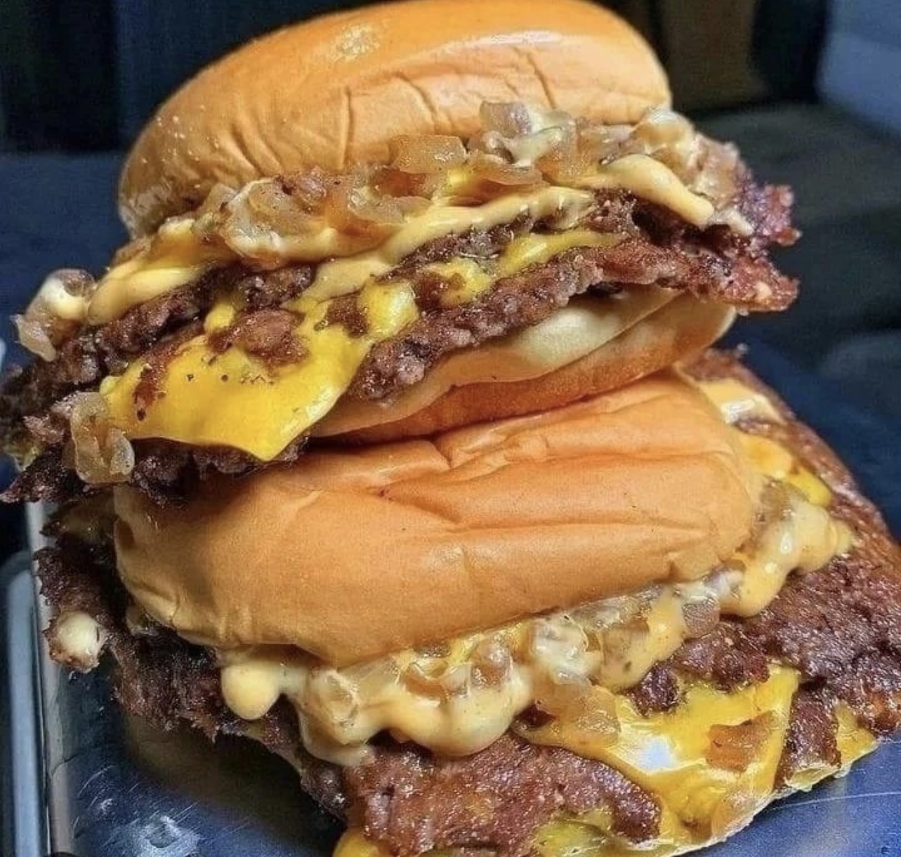 Double smash burger stacked with melted cheese on a toasted brioche bun