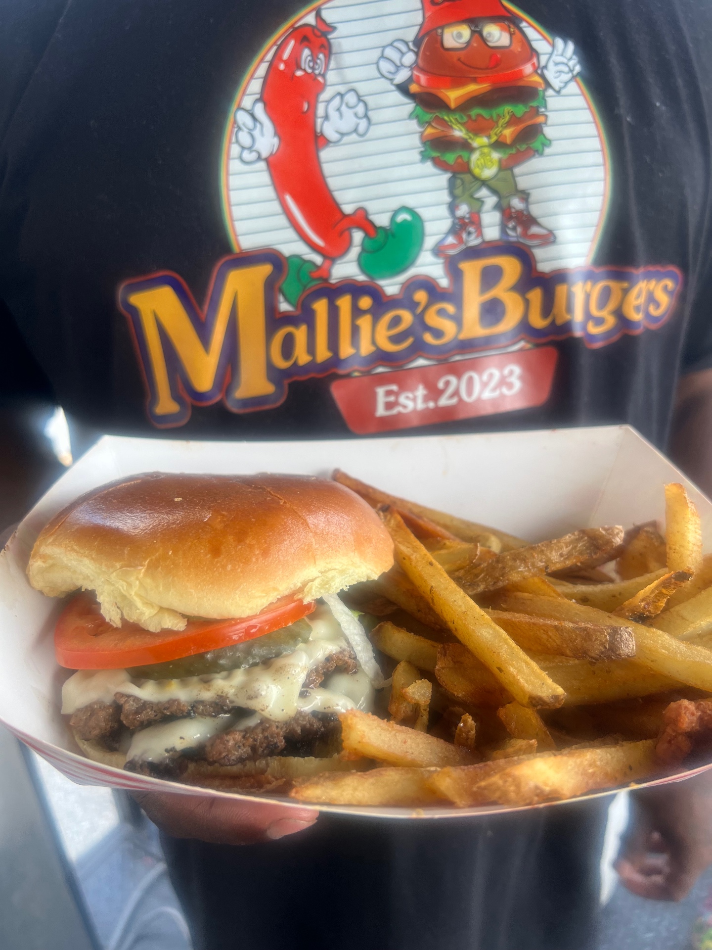 Video of smashburgers cooking on the Mallie's Burgers flat-top grill