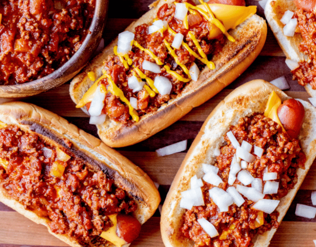 Quarter-pound chili cheese dogs topped with mustard and chopped onions from Mallie's Burgers