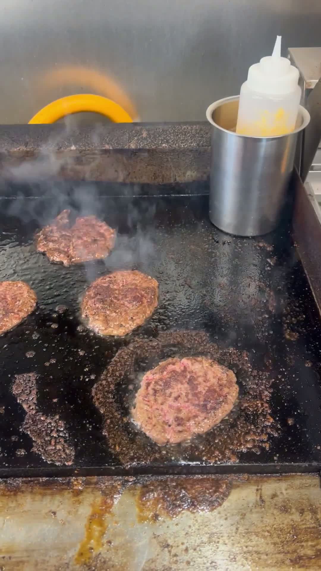 Smashing patties on the griddle